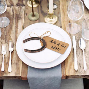 Lucky Horseshoe Gift Tags set as table placeholders at a wedding reception.