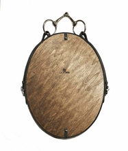 Load image into Gallery viewer, Oval leather mirror with equestrian harness decor, hanging from a snaffle bit, handcrafted by Stephanie Reppas.