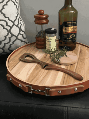 Leather Equestrian Serving Tray with Lazy Susan Base in tan, featuring hand-stitched English leather and teak wood, adorned with a snaffle bit.