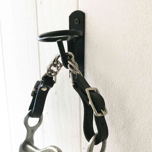 Equestrian Bit Toilet Roll Holder / Tea Towel Hanger, reclaimed curb bit with leather and steel chain, black farm bucket hook, equestrian-themed decor.