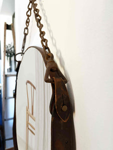 16" primitive chain and leather mirror with distressed leather frame and rustic chain detail.