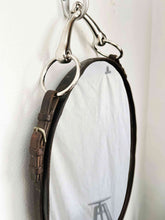 Load image into Gallery viewer, 12&quot;x16&quot; oval equestrian mirror with black leather frame and nickel snaffle bit hanger.