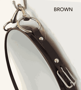 Brown leather equestrian mirror with snaffle bit for horse decor enthusiasts.