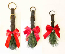 Load image into Gallery viewer, Rustic equestrian leather ornament door greeter with red bows and evergreen accents for holiday decor.