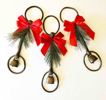 Load image into Gallery viewer, holiday decor rustic iron equestrian bit with red bow and evergreen adornment