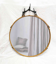 Load image into Gallery viewer, Black and tan leather circle mirror with antique iron bit accent