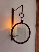 Load image into Gallery viewer, Erica Jacobson magnifying glass wall candle sconces with ivory pillar candle.