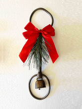 Load image into Gallery viewer, Holiday rustic iron equestrian bit door greeter with red satin bow and bronze bell.